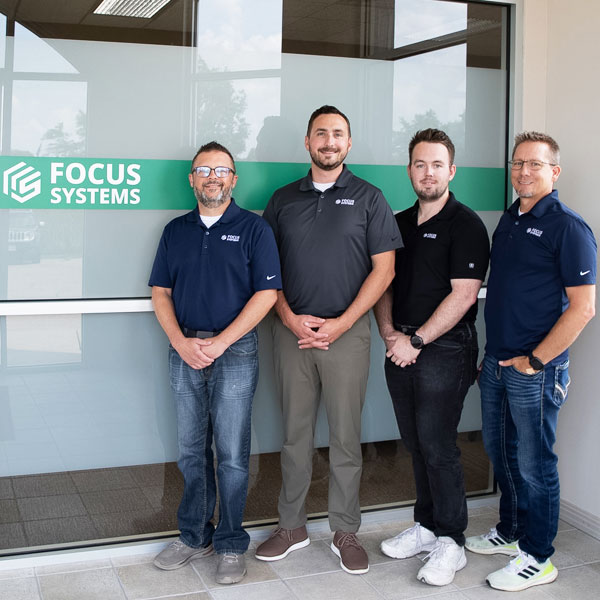 Team Members Standing Outside